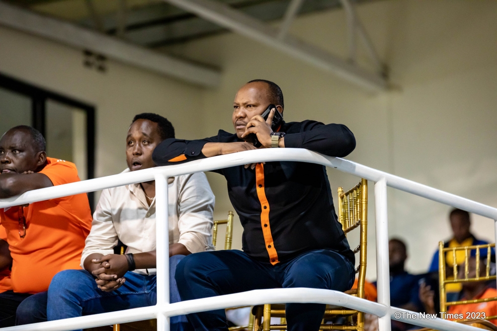 Charles Kakooze Nkuriza (KNC) on call while watching a past match against APR FC at Kigali Pele Stadium. Rwanda Premier League Board is convincing businessman Charles Kakooze Nkuriza (KNC) to reverse his decision to disband Gasogi United- Photo by Craish Bahizi