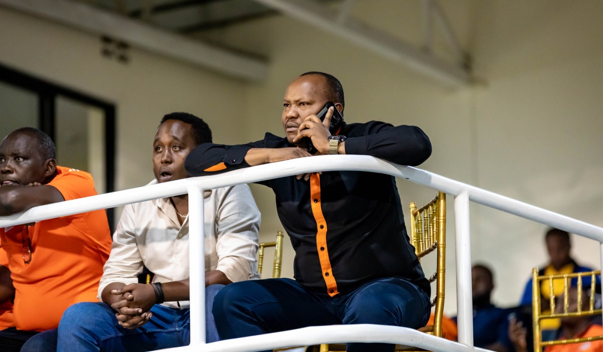 Charles Kakooze Nkuriza (KNC) on call while watching a past match against APR FC at Kigali Pele Stadium. Rwanda Premier League Board is convincing businessman Charles Kakooze Nkuriza (KNC) to reverse his decision to disband Gasogi United- Photo by Craish Bahizi