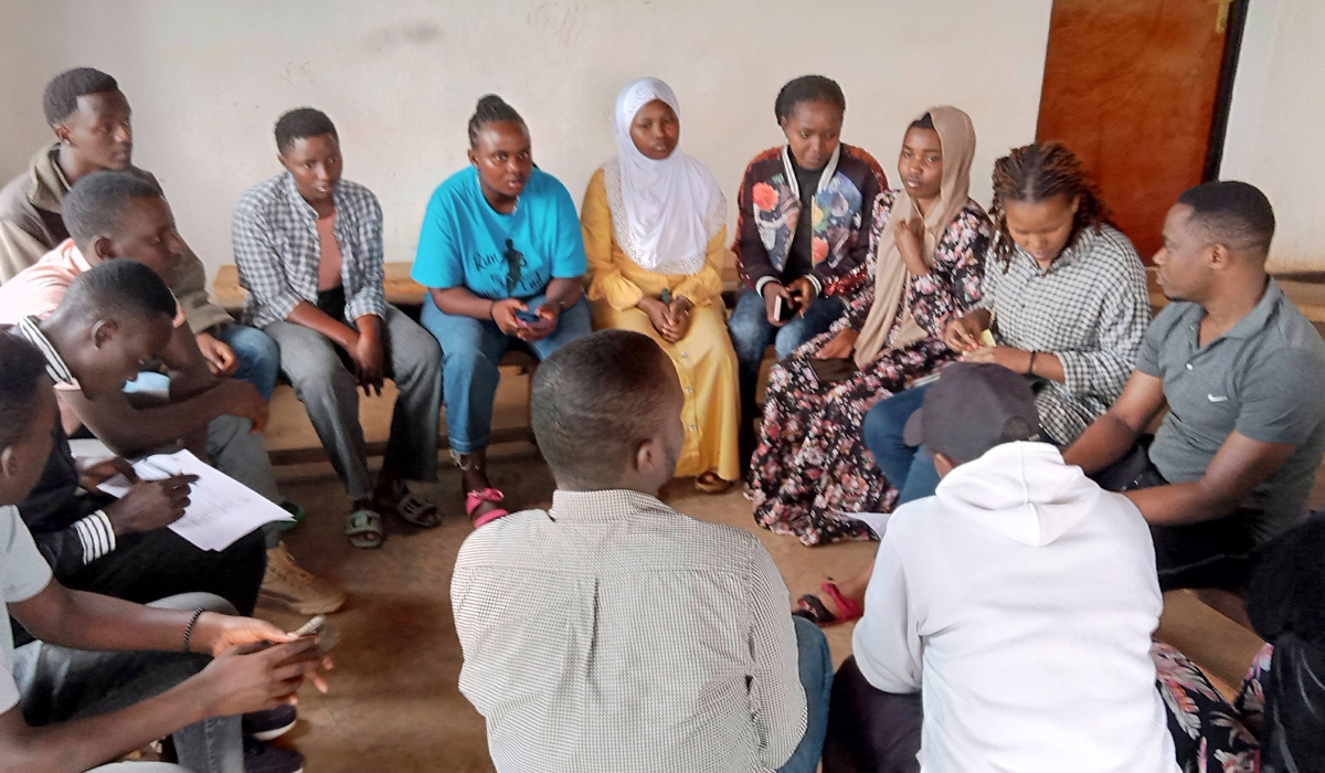 A group of youths born from genocide survivors and perpetrators are gathered in a reconciliation group. Photo by Emmanuel Nkangura