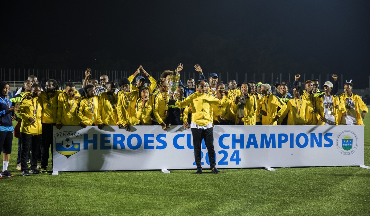 AS Kigali WFC players and staff celebrate the victory after beating Rayon Sports WFC 1-0 to win the 2024 Heroes Cup trophy at Kigali Pele Stadium on Thursday, February 1. Photo by Craish BAHIZI
