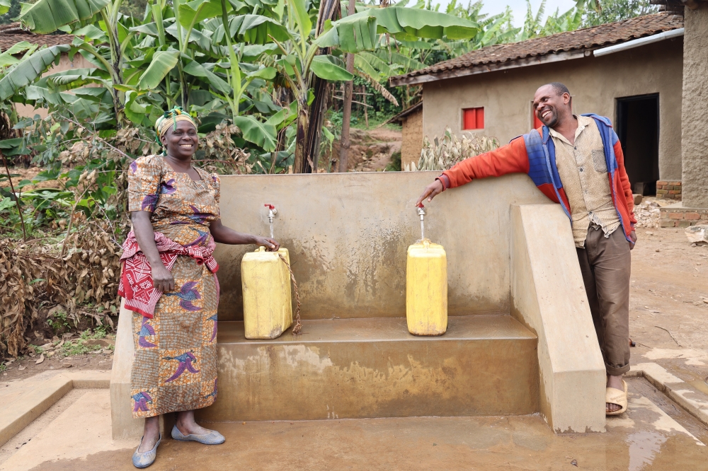 Immaculee - and her neighbors can now enjoy fetching clean water on a public water tap installed just metres from her home in Karongi, western Rwanda