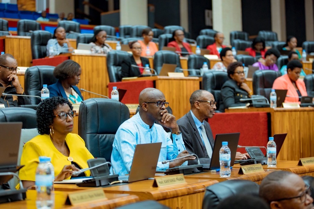 Members of Parliament follow a presentation of the 2023-2024 national budget revision proposals to Parliament, on Thursday, February 8