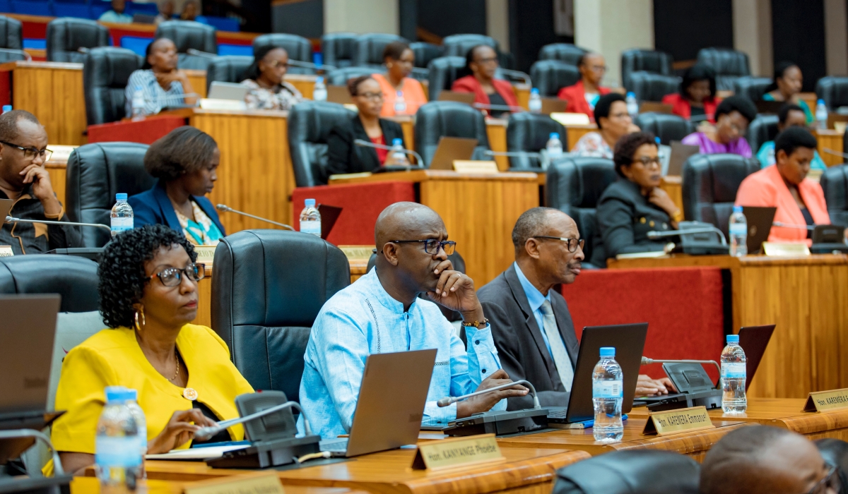 Members of Parliament follow a presentation of the 2023-2024 national budget revision proposals to Parliament, on Thursday, February 8