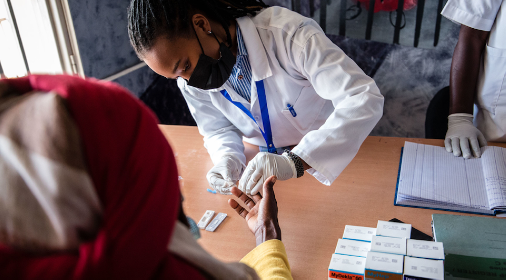 Health Worker testing for hepatitis at Remera Health Center