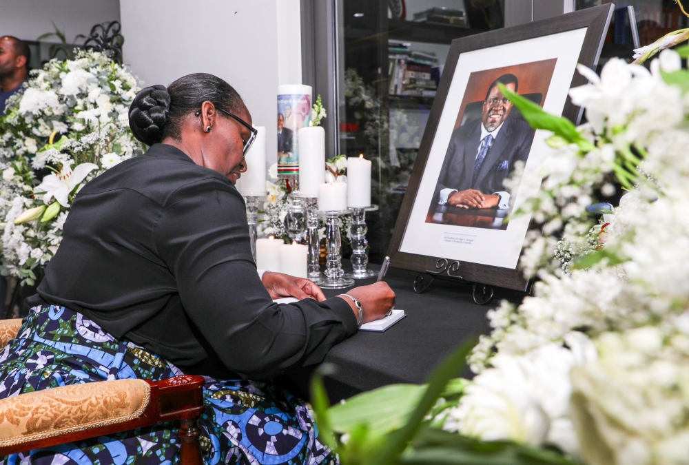 First Lady Jeannette Kagame writes a message of sympathy in the eulogy book of the late President Hage Geingob, in Namibia, on Sunday, February 11. Courtesy