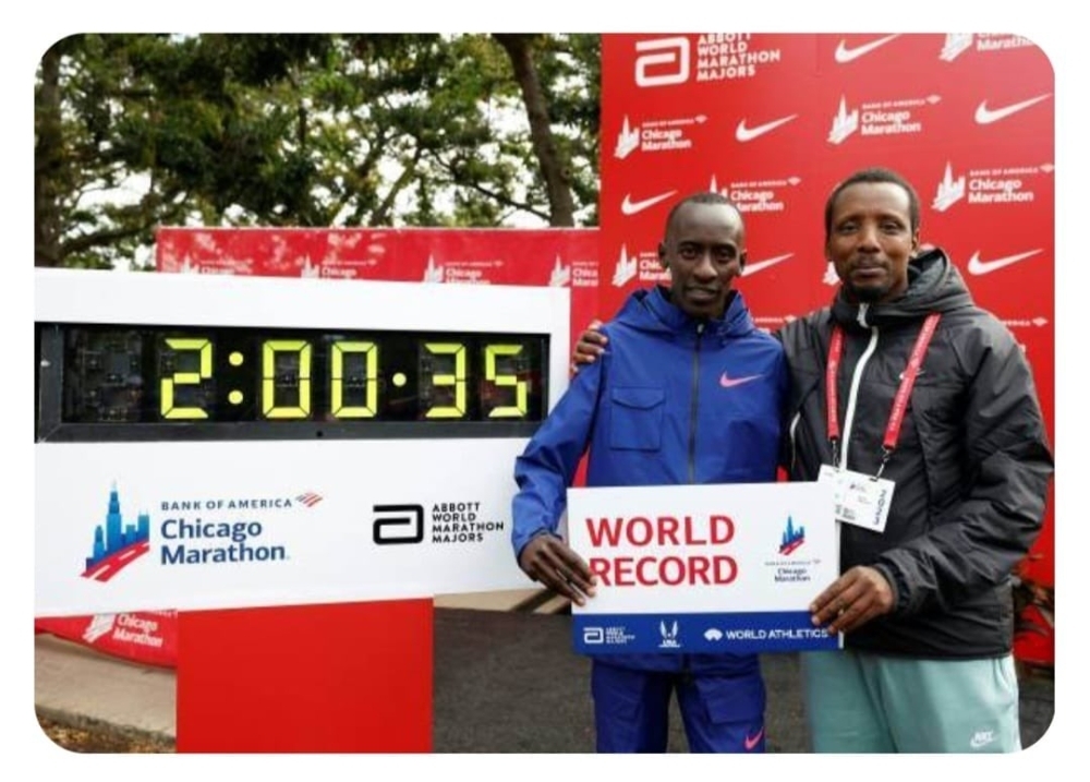 Kiptum (left) and his coach, former Rwandan athlete, Gervais Hakizimana, pose for a picture after the record breaking race in Chicago in October 2023. They both died in a car accident in Kenya on Sunday, February 11. COURTESY