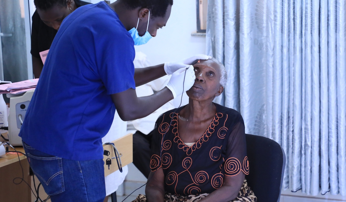 A doctor treats a patient at Masaka Hospital. PHOTO BY CRAISH BAHIZI