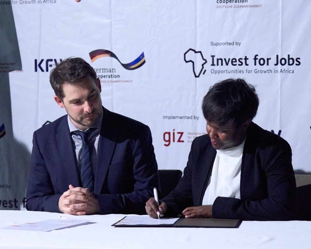 Ariane Inkesha of Solid’Africa signing the finance agreement with Steffen Khul the MD of IFE 