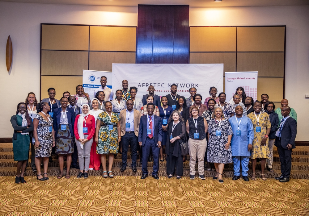 Participants and delegates pose for a group photo during the event that was held in Kigali on February 19.