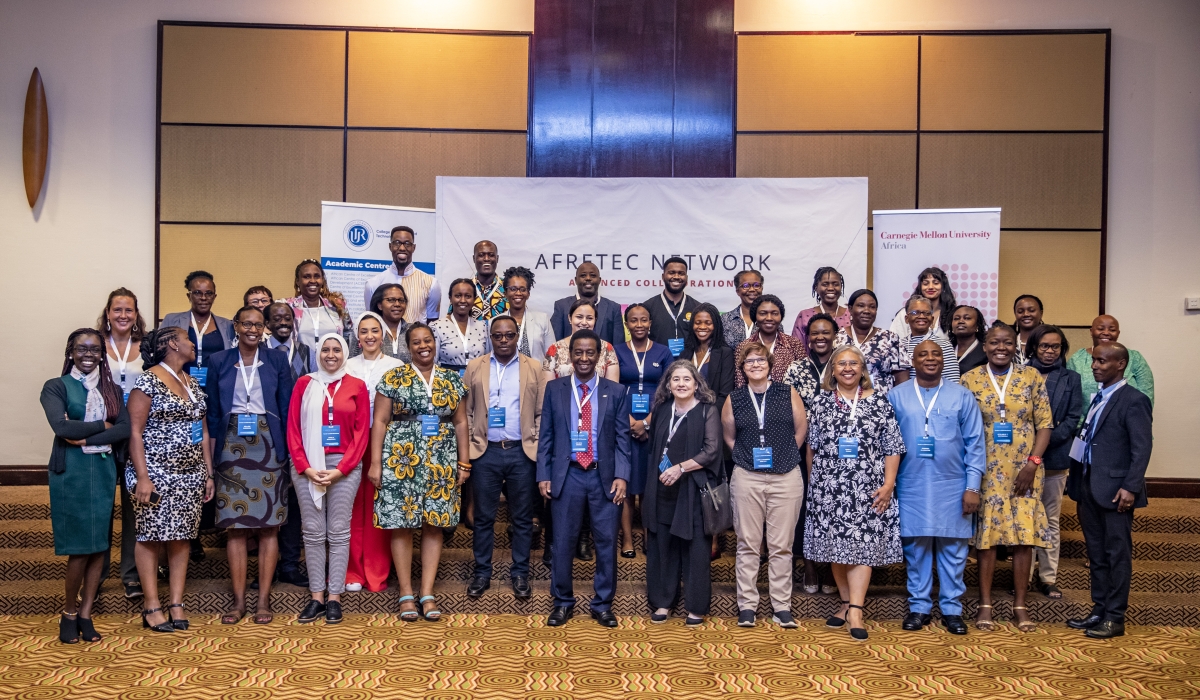 Participants and delegates pose for a group photo during the event that was held in Kigali on February 19.