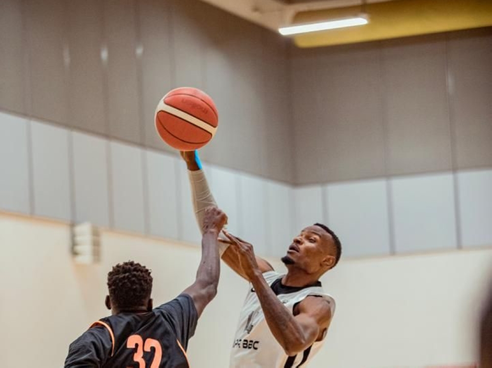 APR&#039;s Bush Wamukota (R) vies for the ball with an Al Wakrah player during the game.