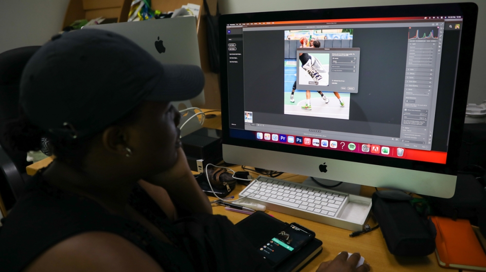 A content creator employs Adobe Photoshop&#039;s AI enhancer to edit basketball photos, transforming them with ease. ALL PHOTOS BY Willy Mucyo.