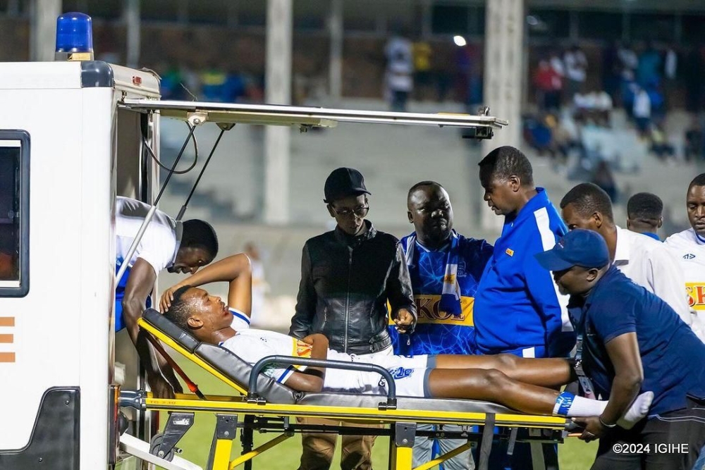 Rayon Sports striker Prince Rudasingwa being stretched into an ambulance after a nasty collision with Anicet Muhire