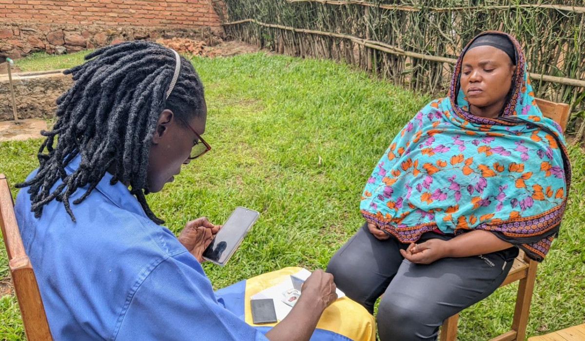 A community health worker collecting the data of a citizen using electronic community health system in Rwamagana district on Feberuary 22. Photo by Patrick Nzabonimpa