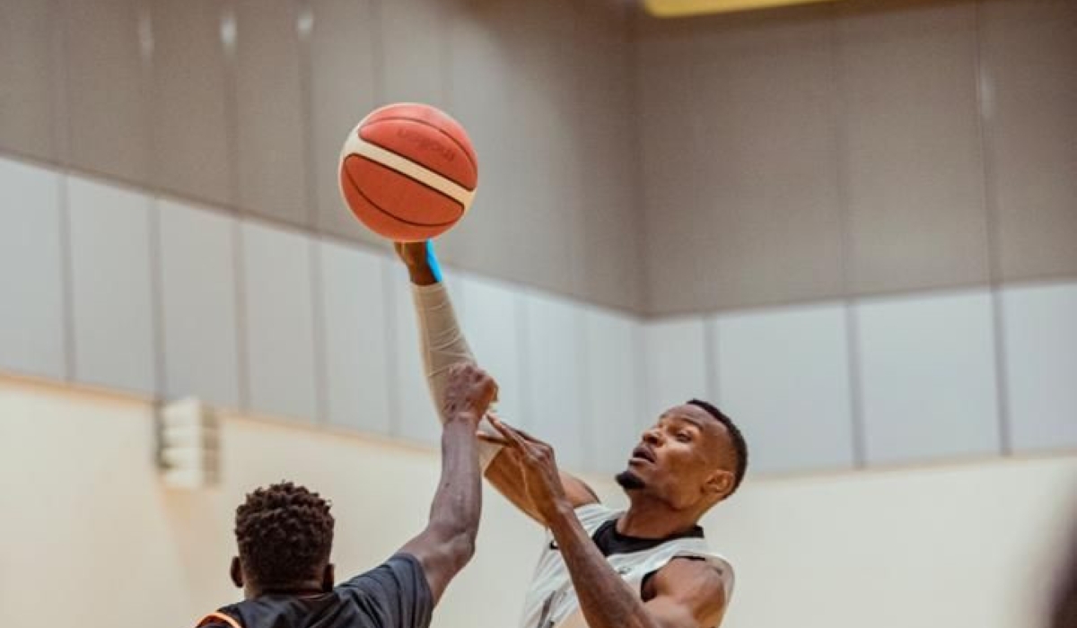 APR&#039;s Bush Wamukota (R) vies for the ball with an Al Wakrah player during the game.