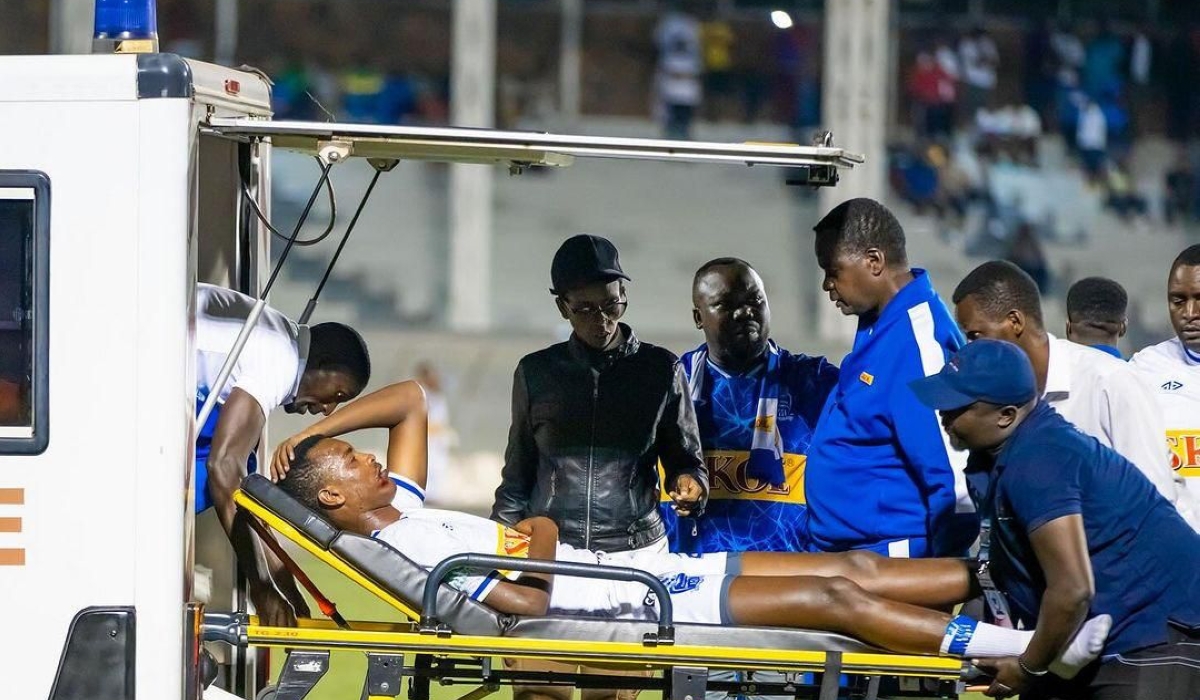 Rayon Sports striker Prince Rudasingwa being stretched into an ambulance after a nasty collision with Anicet Muhire