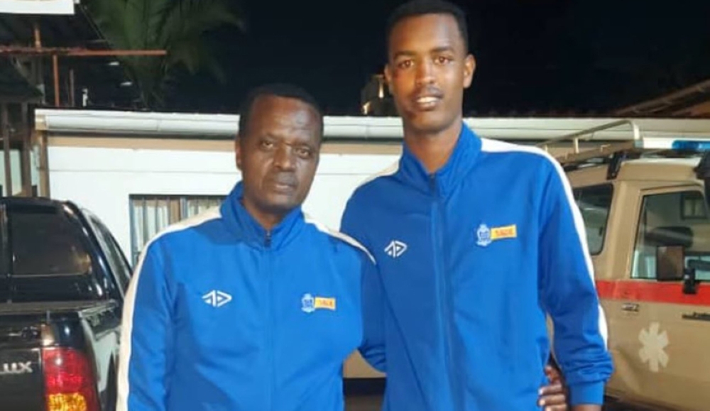 Prince Rudasingwa (R) is pictured here with Rayon Sports team doctor Charles Mugemana after he was discharged from CHUK at 3am on Saturday. courtesy