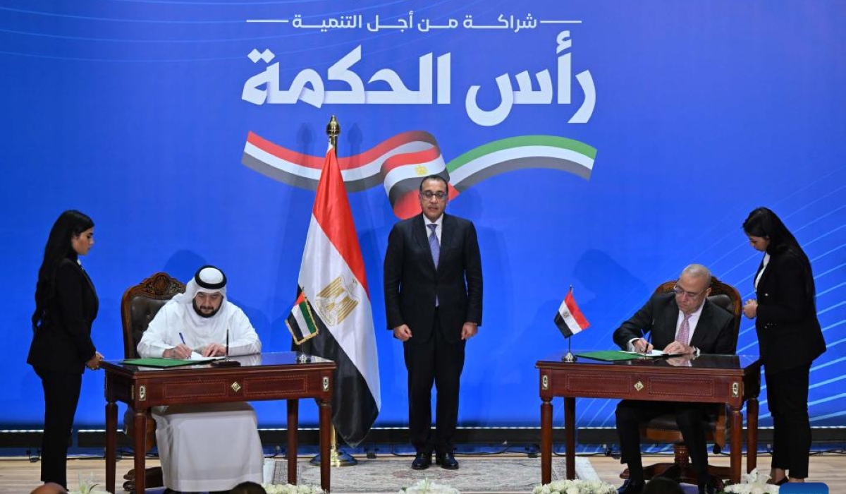 Egyptian Prime Minister Mostafa Madbouly (C) witnesses the signing of an agreement between Egypt and the United Arab Emirates in New Administrative Capital, Egypt, on Feb. 23, 2024. Egypt and the United Arab Emirates (UAE) signed the deal on Friday to build a new city on Egypt&#039;s northern coast, with the aim of boosting tourism, investment and foreign currency reserves. (Str/Xinhua)