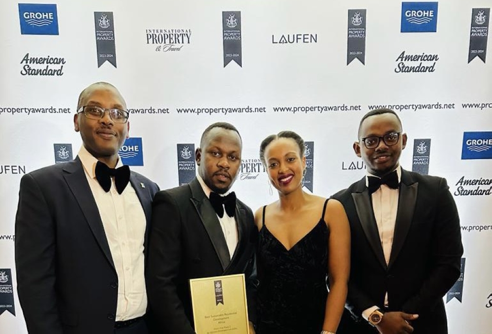 L-R: Moses Katusime, General Counsel and Secretary; Richard Kabano, Sales Manager; Paola Musoni, Head of Real Estate at RSSB; and Alain Tuyishime, Marketing and Communications Manager at UDL, display the award in London, UK.