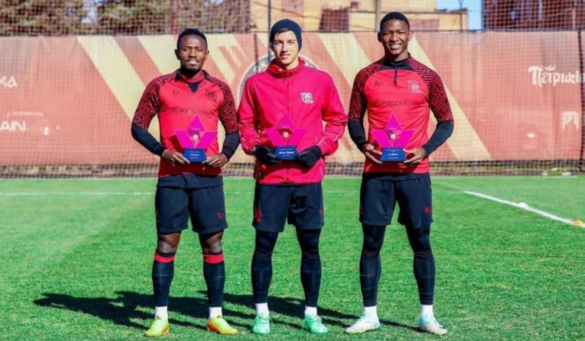 Djihad Bizimana (L) with his FC Kryvbas December player of the month award.