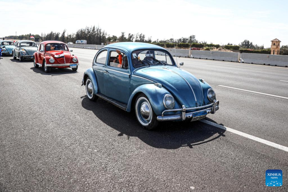 Vintage cars travel on a highway during a grand vintage car cruise in Cairo, Egypt, on March 1, 2024. (Xinhua/Ahmed Gomaa)