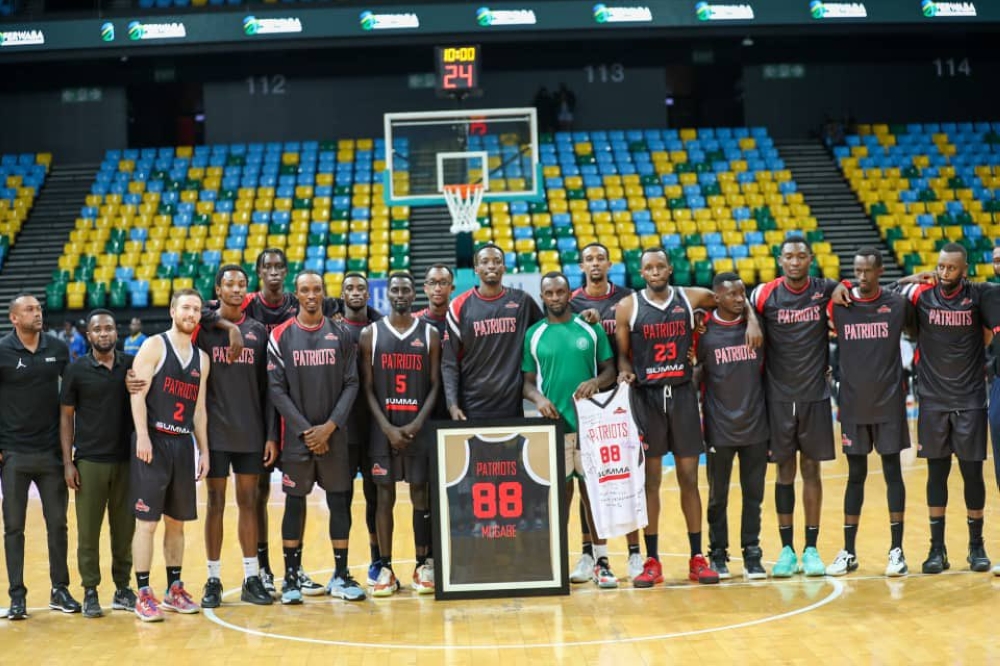 Aristide Mugabe joins his former teammates at Patriots as club officially retired his No 88 jersey in honor of the point guard who currently plays for Kepler-Photo by Dan Gatsinzi