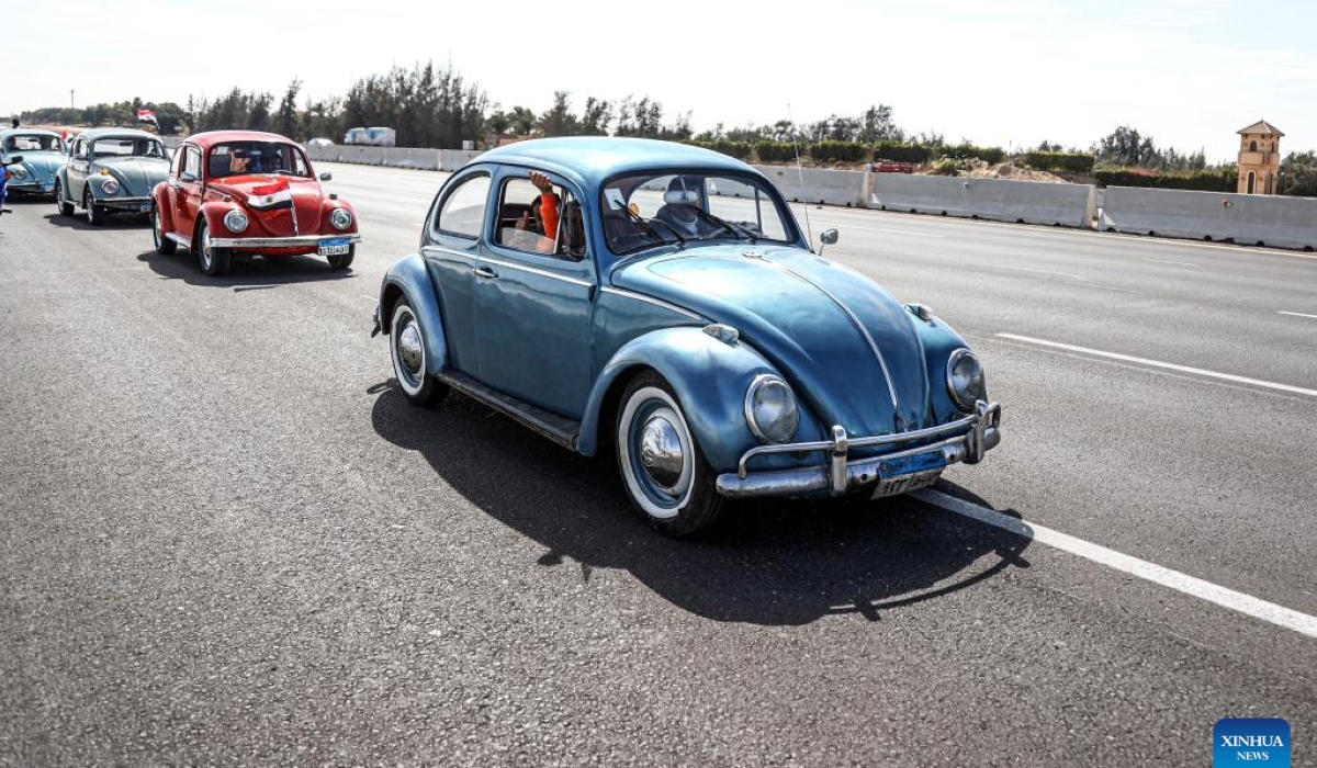 Vintage cars travel on a highway during a grand vintage car cruise in Cairo, Egypt, on March 1, 2024. (Xinhua/Ahmed Gomaa)
