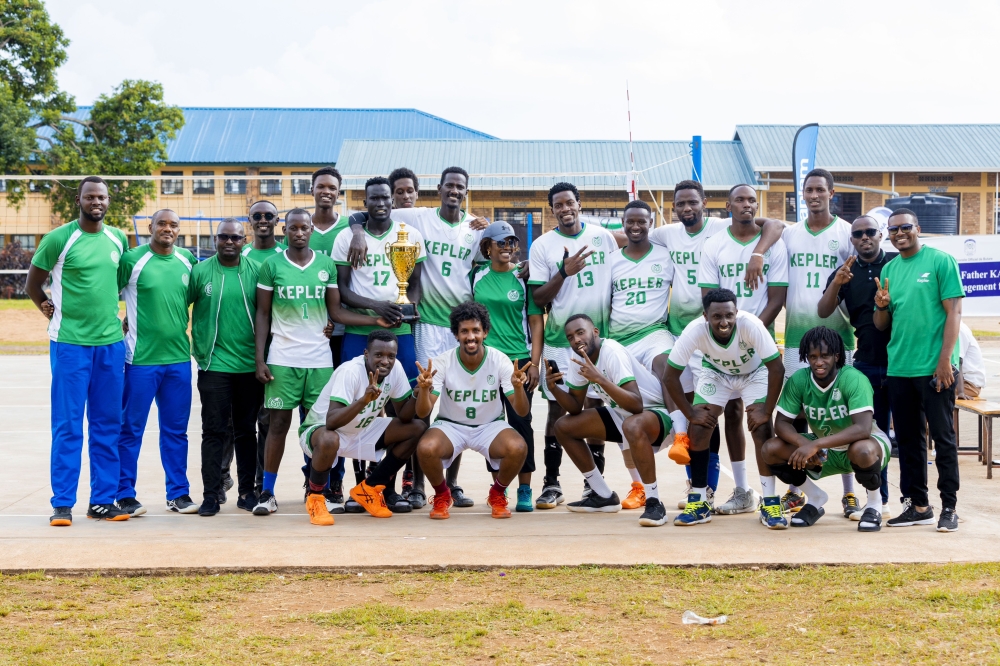 Kepler Volleyball team pose for a group photo with the trophy after overpowering Police VC through a decisive 3-0 set victory. Courtesy