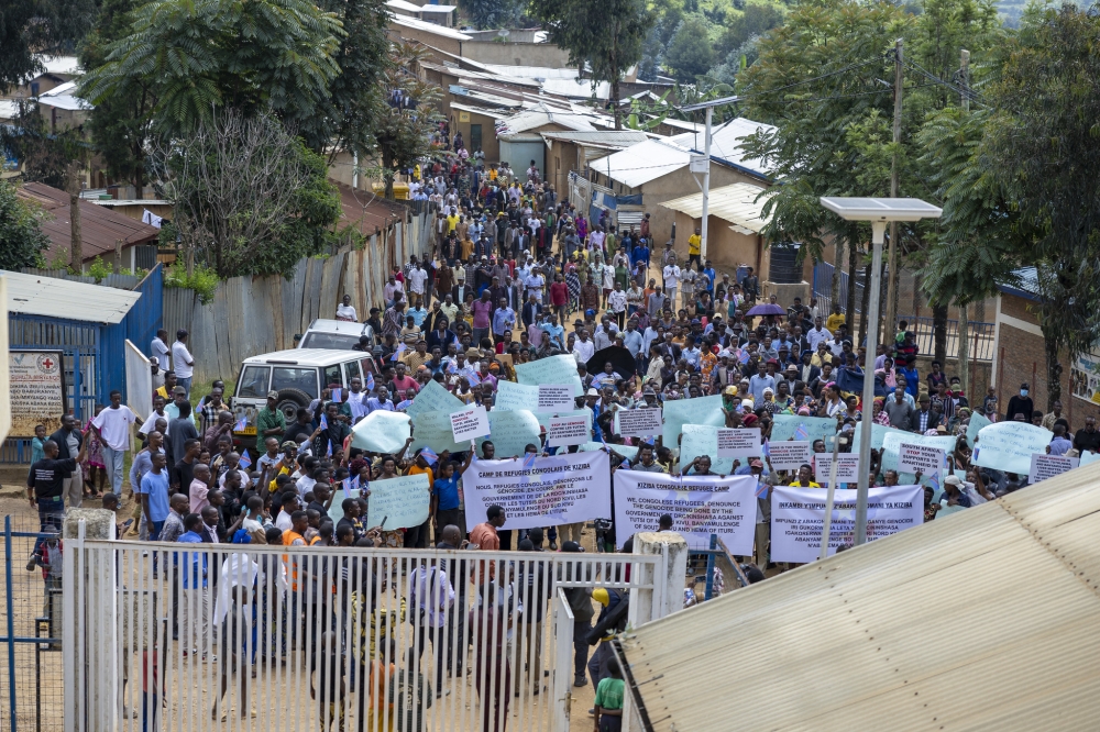 Congolese refugees in Rwanda during a peaceful march in protest of killings of Tutsi, Banyamulenge and Hema communities in eastern DR Congo in Karongi District at Kiziba camp on Monday, March 4. Photos by Olivier Mugwiza