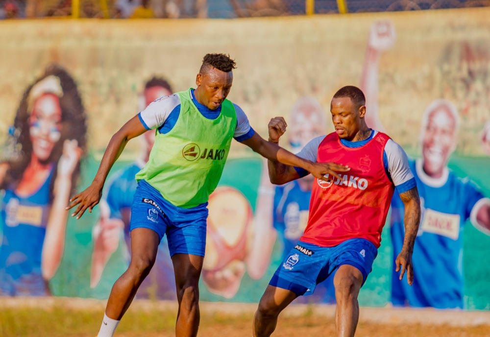 Rayon Sports defender Aimable Nsabimana (left) with former team Captain Abdoul Rwatubyaye during  a training session at Nzove football pitch. Courtesy.