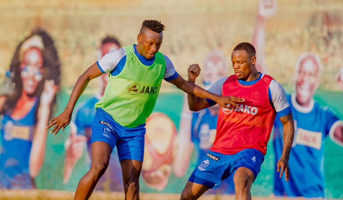 Rayon Sports defender Aimable Nsabimana (left) with former team Captain Abdoul Rwatubyaye during  a training session at Nzove football pitch. Courtesy.