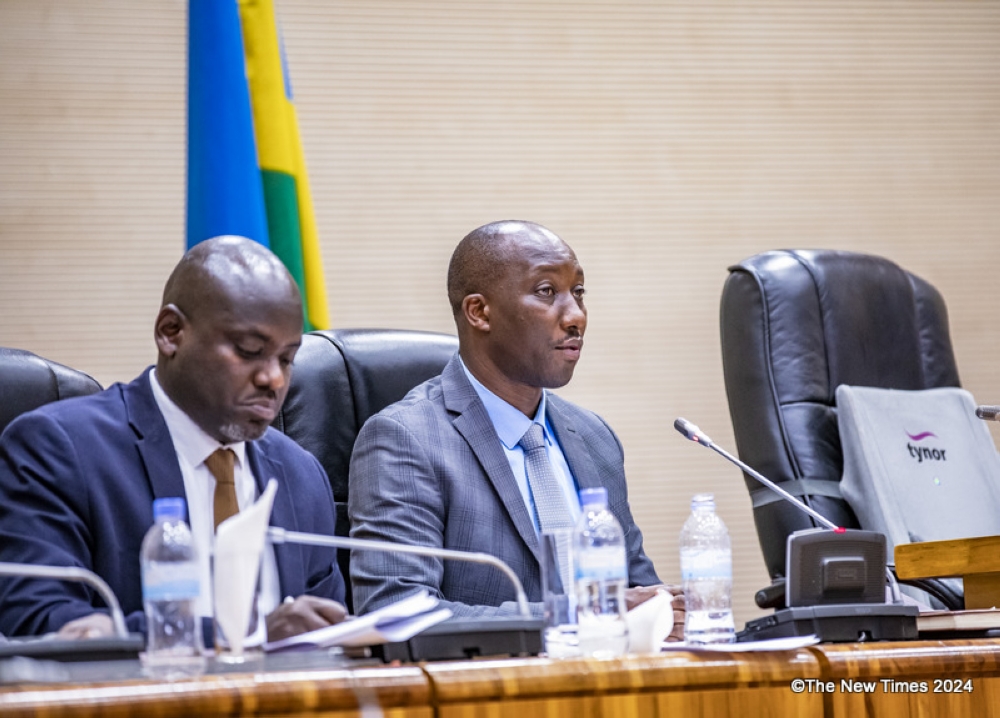 The Minister of Infrastructure, Jimmy Gasore, addresses members of parliament while responding to issues related to Rwanda’s electricity production and distribution on Tuesday, March  5. Emmanuel Dushimimana