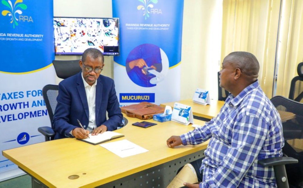 Rwanda Revenue Authority (RRA) Commissioner General, Pascal Bizimana Ruganintwali, receives a customer at the headquarters. File