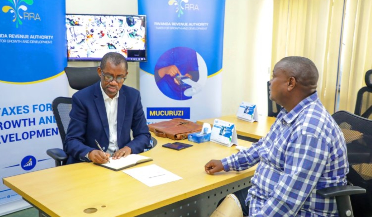 Rwanda Revenue Authority (RRA) Commissioner General, Pascal Bizimana Ruganintwali, receives a customer at the headquarters. File