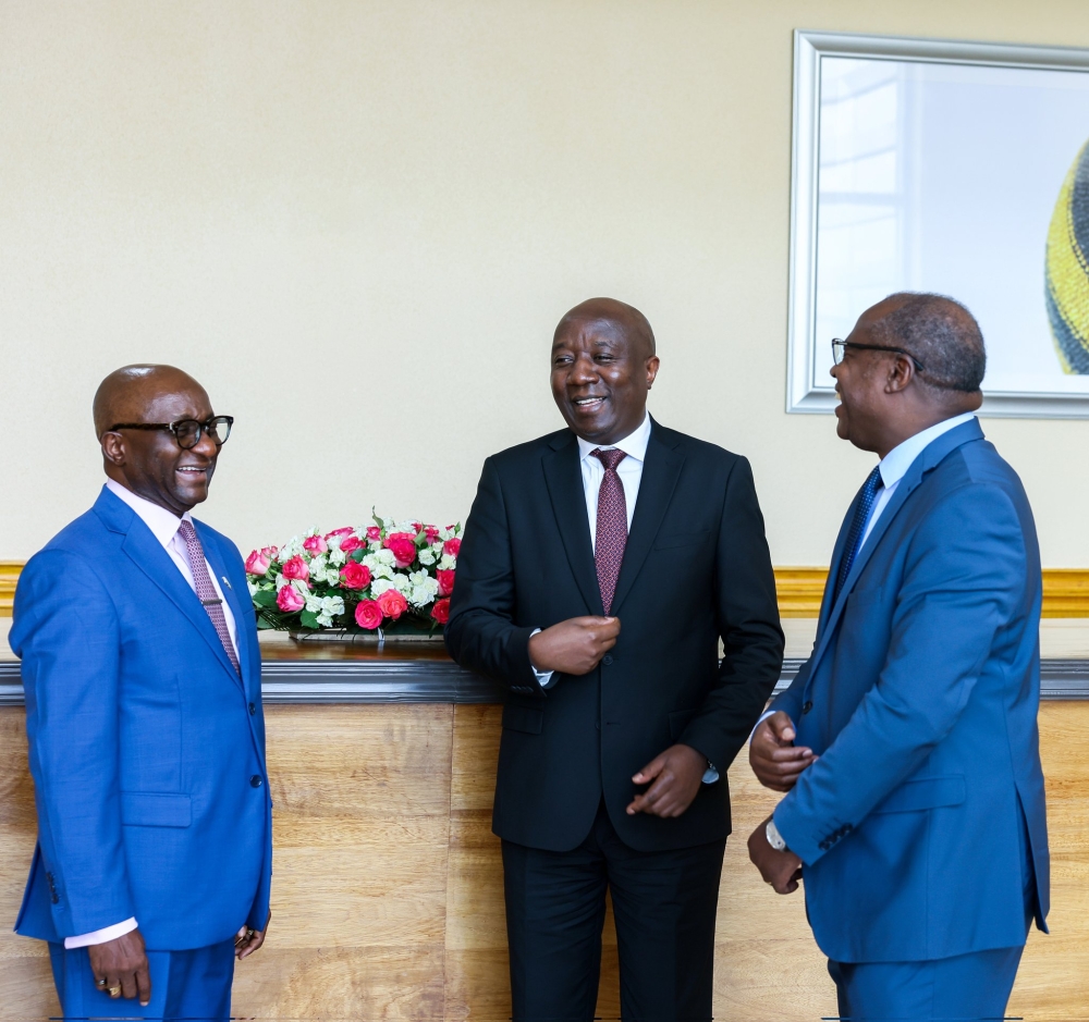 Prime Minister Edouard Ngirente interacts with Sahr John Kpundeh, the Country Manager for the World Bank in Rwanda and Minister of Finance Uzziel Ndagijimana (R) after a meeting on Friday, March 8. Courtesy