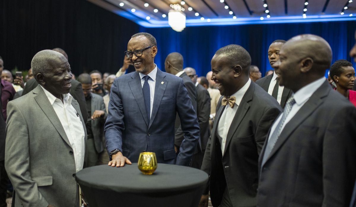 President Paul Kagame shares a light moment with Samuel Mugisha, his former teacher at Ntare School, Apollo Kashanku, the chairman of Ntare School Old Boys Association (NSOBA), and current Ntare School Headmaster Saul Rwampororo, during a cocktail at Kigali Convention Centre on Friday, March 8. Mugisha, Kashanku, Rwampororo, and over 500 members of Ntare School alumni earlier travelled to Kigali for the finals of the Ntare Lions League (NLL) football tournament, from March 7 to 10.