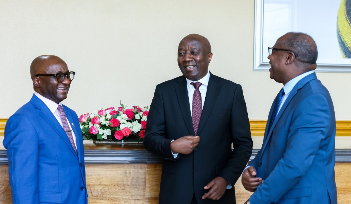 Prime Minister Edouard Ngirente interacts with Sahr John Kpundeh, the Country Manager for the World Bank in Rwanda and Minister of Finance Uzziel Ndagijimana (R) after a meeting on Friday, March 8. Courtesy
