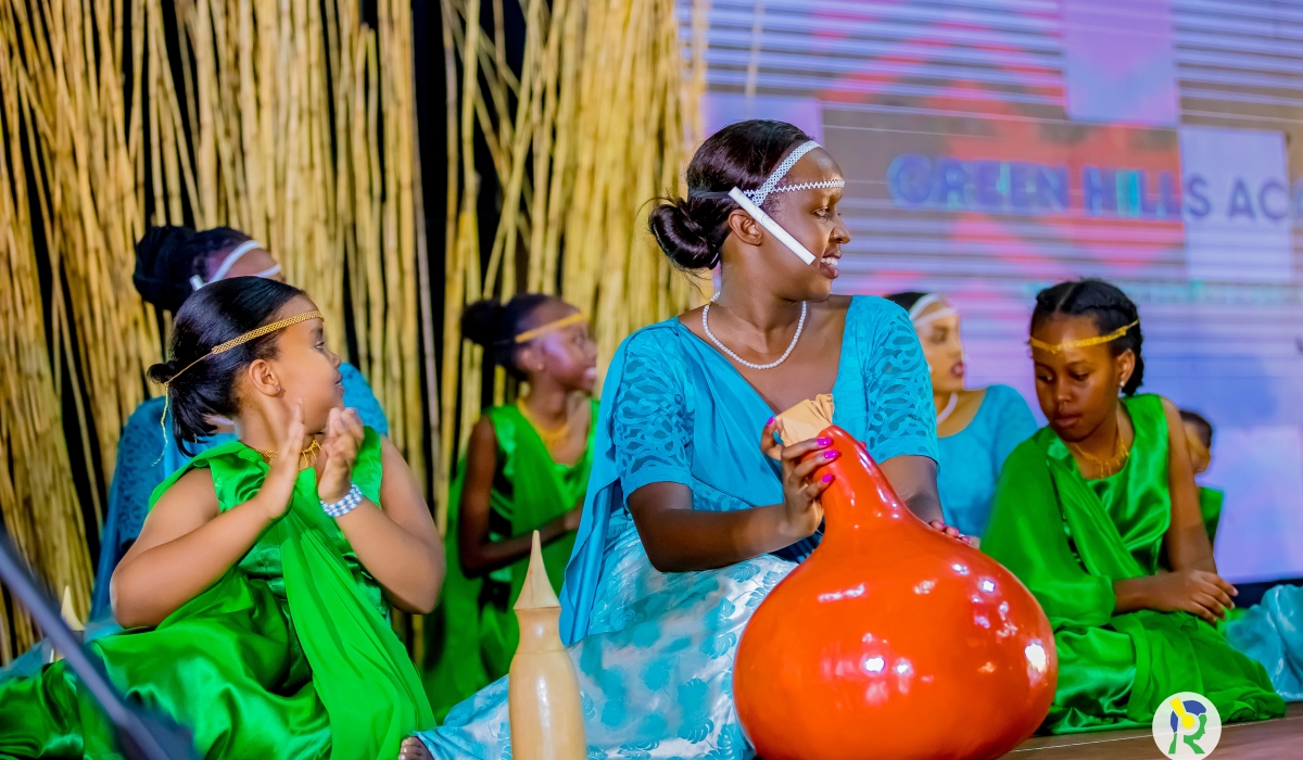  Inganzo ngari performing with &#039;Ibisabo&#039;— a milk churning gourd used in the Rwandan culture at the event.. Photos by Inyarwanda