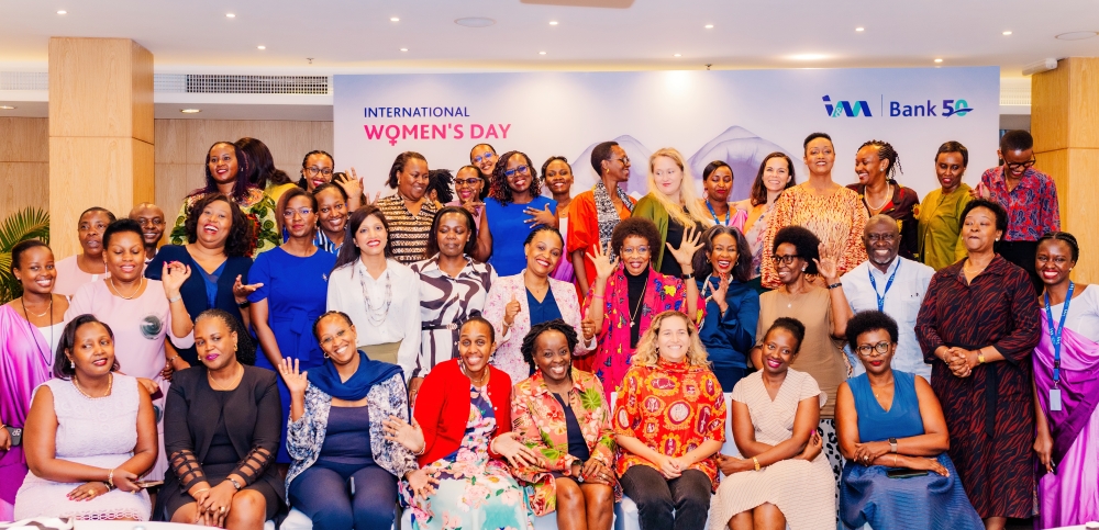 Attendees pose for a group photo during an event to celebrate the International Women’s Day on March 9.