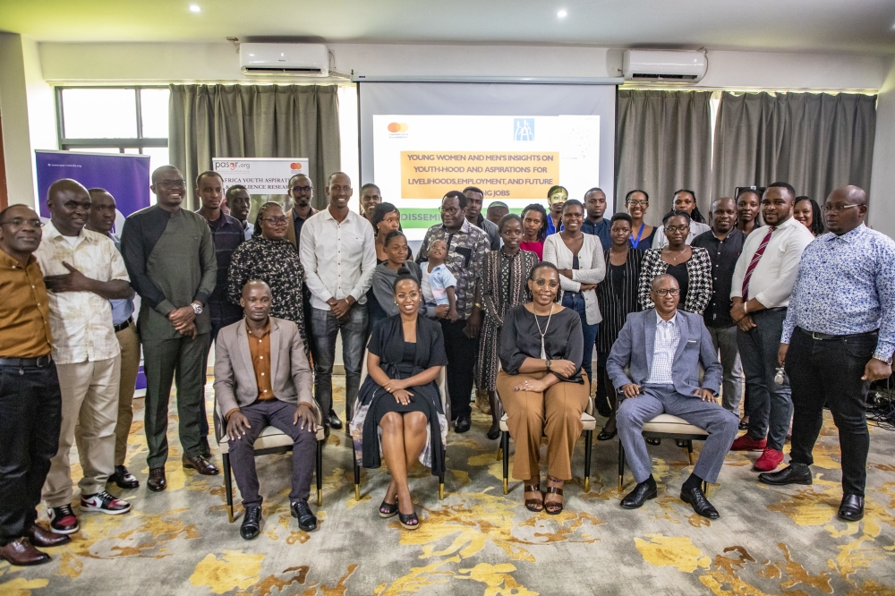 Participants pose for a photo during the dissemination and engagement workshop to present and discuss the findings of the study on March 14 at M-Hotel. Photos by Emmanuel Dushimimana
