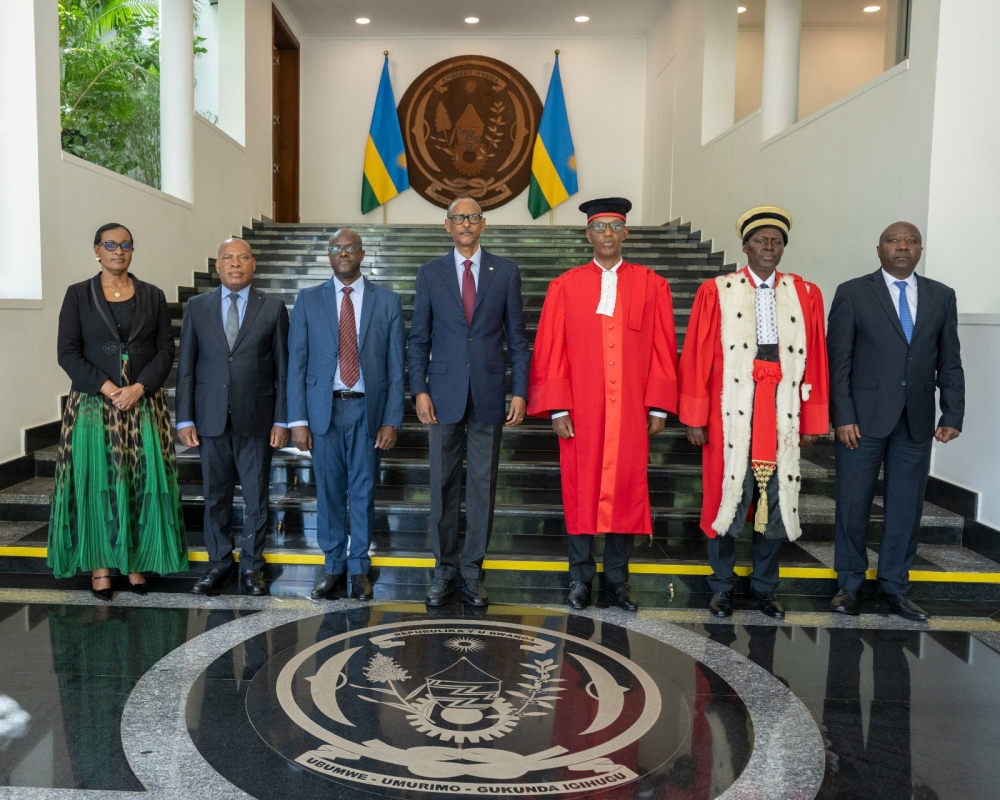 President Paul Kagame poses for a group photo with government officials after the swearing-in ceremony of newly appointed deputy CEO of the Rwanda Governance Board, Dr Felicien Usengumukiza (third from left), and Judge Kadigwa Gashongore, vice president of the Commercial High Court (third from right) at Village Urugwiro on March 15.