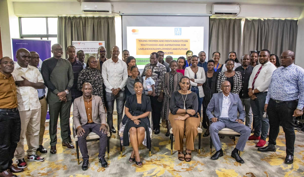Participants pose for a photo during the dissemination and engagement workshop to present and discuss the findings of the study on March 14 at M-Hotel. Photos by Emmanuel Dushimimana
