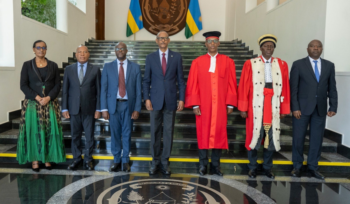 President Paul Kagame poses for a group photo with government officials after the swearing-in ceremony of newly appointed deputy CEO of the Rwanda Governance Board, Dr Felicien Usengumukiza (third from left), and Judge Kadigwa Gashongore, vice president of the Commercial High Court (third from right) at Village Urugwiro on March 15.