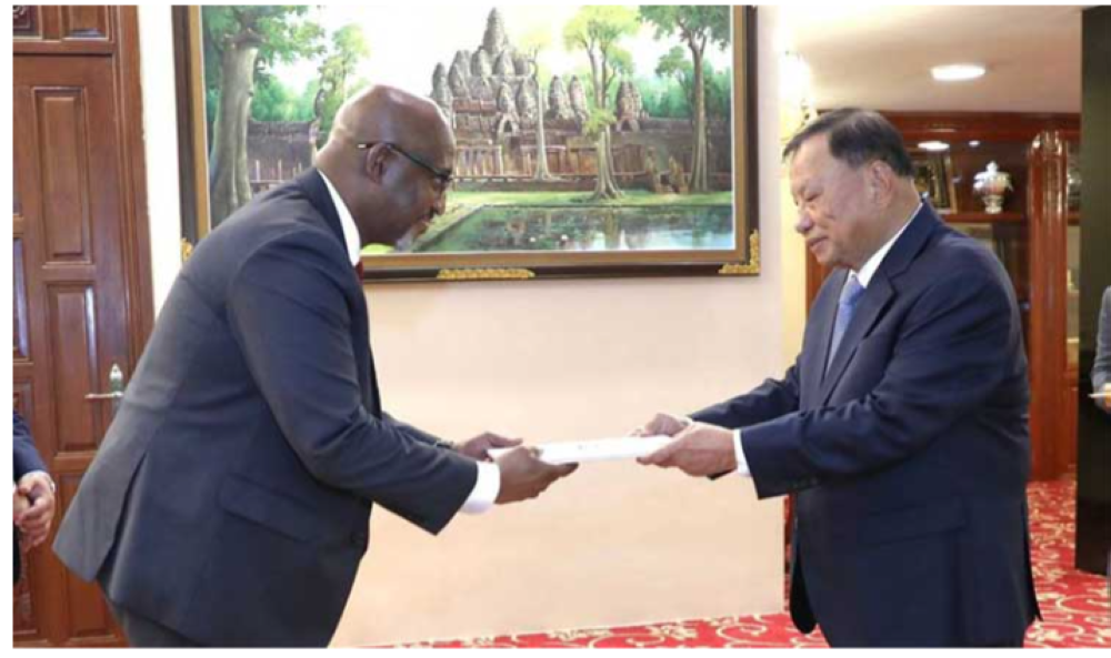 Ambassador Nkubito Manzi Bakuramutsa  presenting his letters of credence to His Excellency Say Chhum, the Acting Head of State of Cambodia. Courtesy