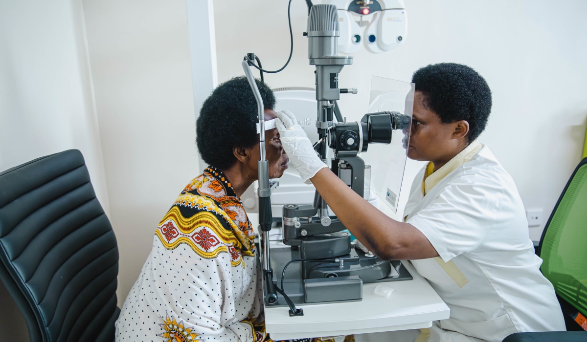 Donatha Mujawamariya, an ophthalmology nurse  conducts eye screenning at Rwanda Charity Eye Hospital. Photo by Willy MUCYO