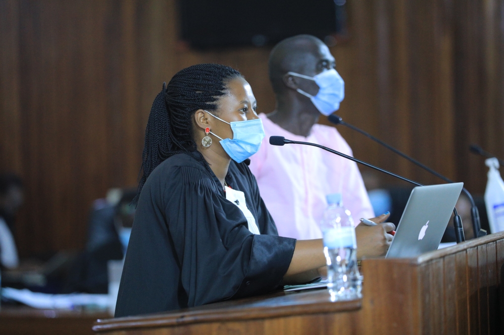 A female lawyer assisting her client during FLN trial. More than 400 lawyers in Rwanda gathered this week to discuss a solidarity fund that could assist new mothers on their maternity leave. Sam Ngendahimana