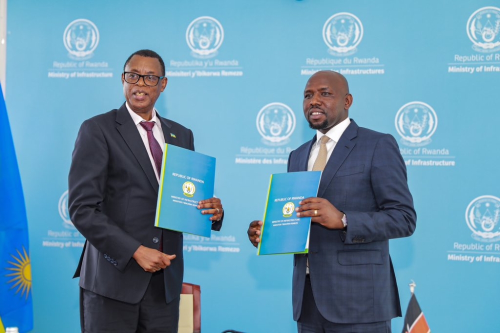 James Kabarebe, Minister of State in Charge of Regional Cooperation and Kipchumba Murkomen, the Kenyan Cabinet Secretary for Roads and Transport during the signing on March 19.Courtesy