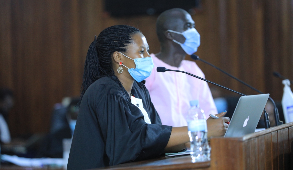 A female lawyer assisting her client during FLN trial. More than 400 lawyers in Rwanda gathered this week to discuss a solidarity fund that could assist new mothers on their maternity leave. Sam Ngendahimana