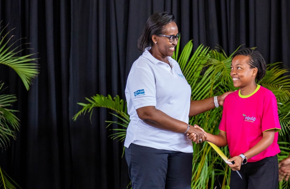 First Lady Jeannette Kagame awarding one of the best performing girls during the awarding ceremony held at Maranyundo Girls School on Friday, March 22. All photos by Dan Gatsinzi