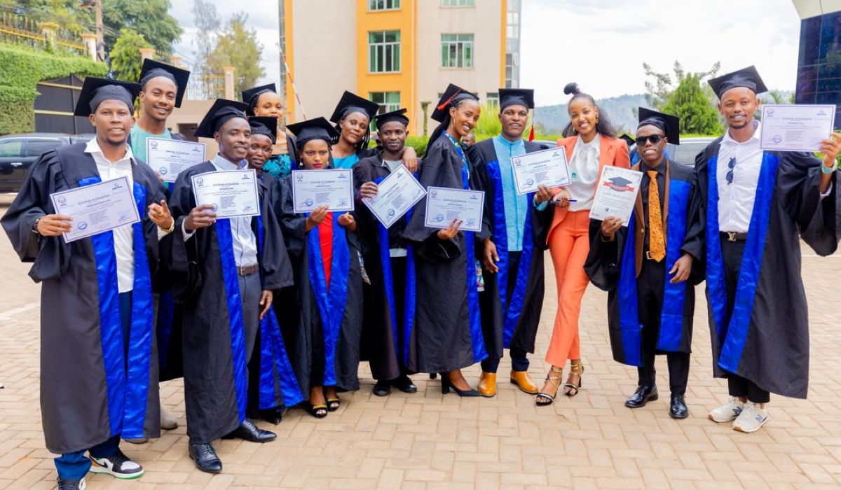 Graduates pose for a group photo with their certificates at the ceremony on March 22.